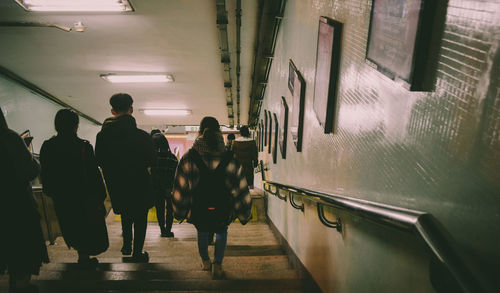 People walking on railroad station platform