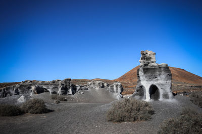 Low angle view of fort against blue sky