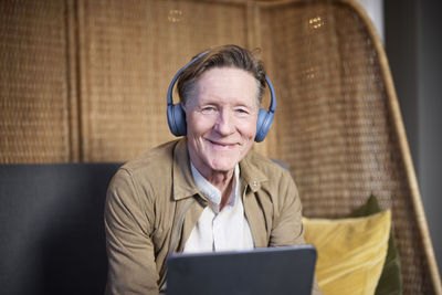 Portrait of senior man in headphones