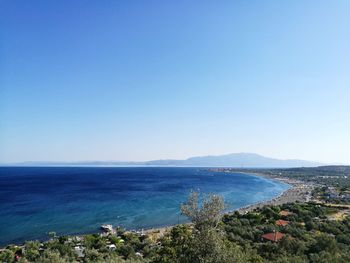 Scenic view of sea against clear blue sky