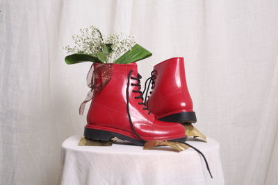 Close-up of red shoes against white background