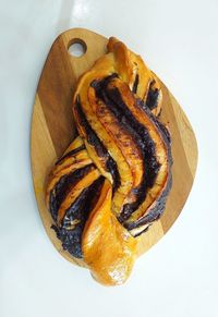 High angle view of bread on table against white background