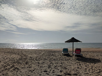 Dramatic view of beach chairs on empty beach during corona lockdown