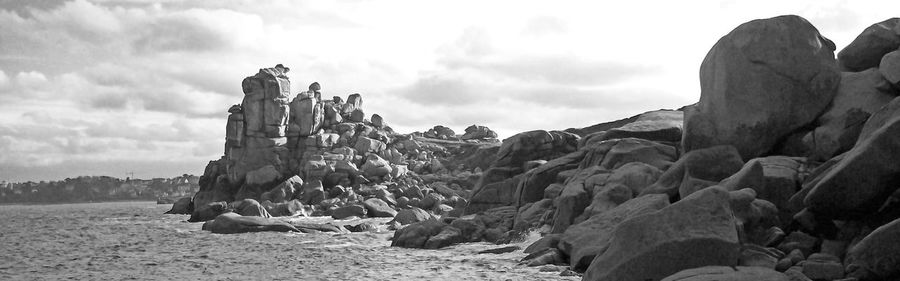 Panoramic view of rock formations against sky