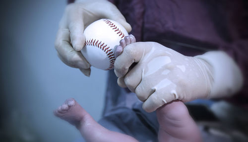 Close-up of hand holding ball