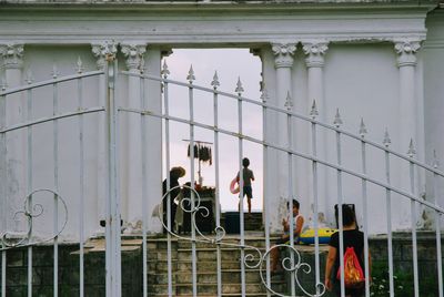 People in city against sky