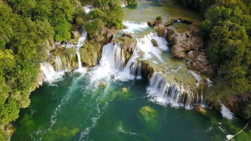 High angle view of waterfall in forest