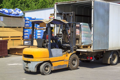 Man driving forklift outdoors