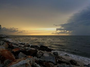 Scenic view of sea against sky at sunset