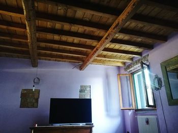 Low angle view of hanging ceiling at home