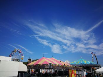 Amusement park ride against blue sky