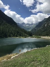 Scenic view of lake and mountains against sky