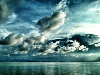 Scenic view of sea against cloudy sky