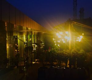 Illuminated lamp post at night