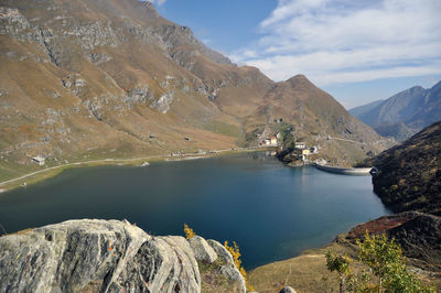 Scenic view of lake and mountains against sky