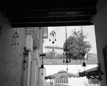 Low angle view of bells hanging in house