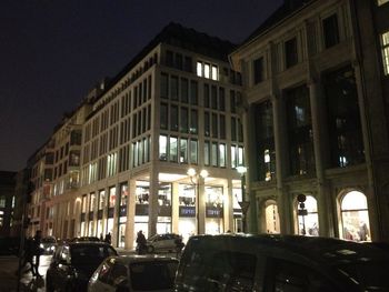 View of illuminated buildings in city