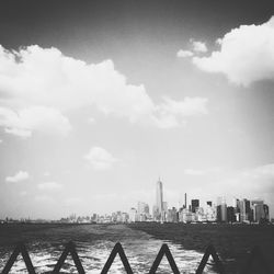 City skyline against cloudy sky