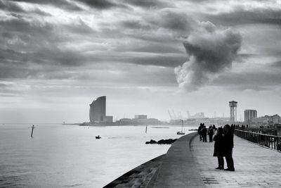 View of city against cloudy sky