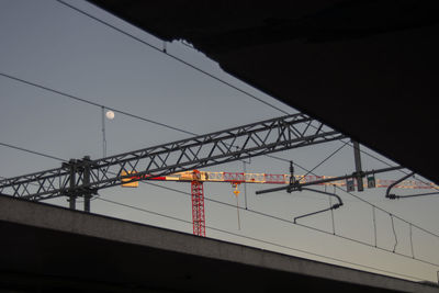 Low angle view of bridge against sky in city