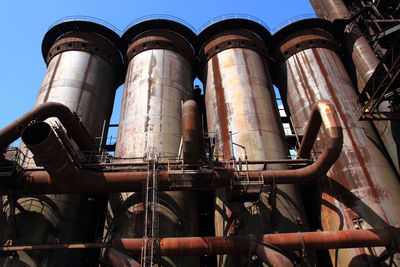 Low angle view of smoke stack against sky