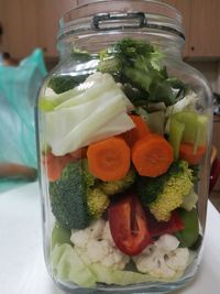 Close-up of chopped vegetables in glass jar