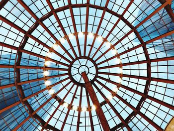 Low angle view of skylight seen through glass roof