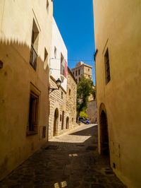 Narrow alley amidst buildings in town