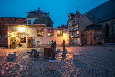 Buildings in city at night