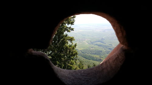 Scenic view of mountains against sky seen through arch