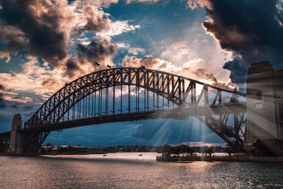 View of bridge against cloudy sky