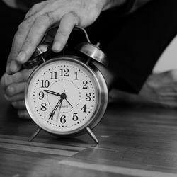 Close-up of clock on table