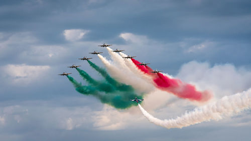 Low angle view of airshow in sky