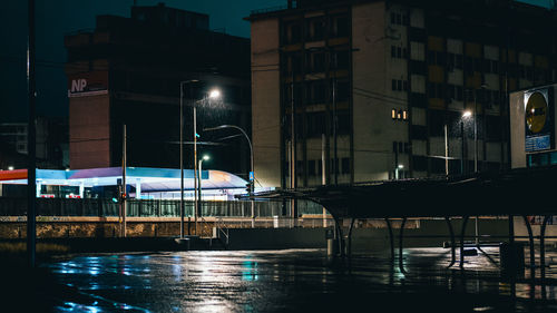 Illuminated buildings in city at night