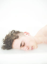 Close-up of mid adult man over white background