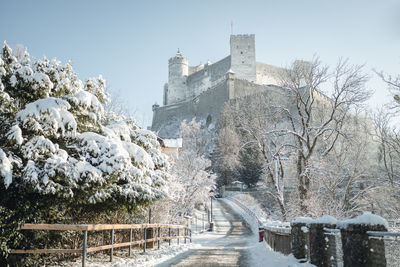 Snow covered fortress hohensalzburg above salzburg, austria