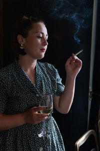 Close-up of woman smoking cigarette