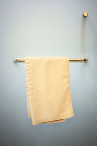 Clean white hand towel on a hanger.