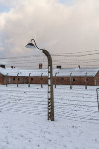 Snow covered field against sky