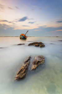 Scenic view of sea against sky during sunset