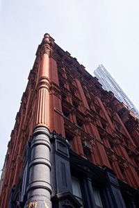 Low angle view of building in city against clear sky