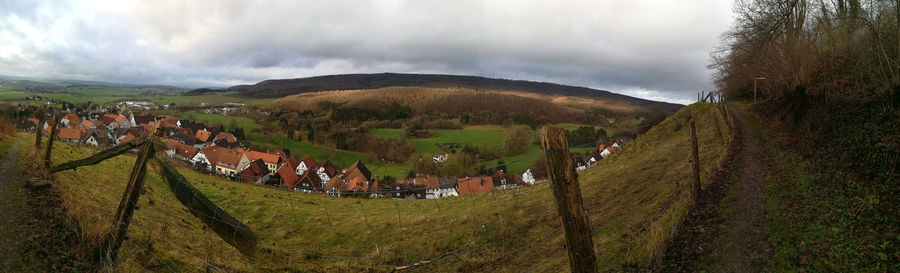 Panoramic view of landscape against cloudy sky