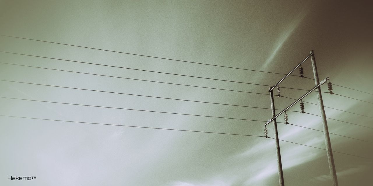 LOW ANGLE VIEW OF POWER LINES AGAINST SKY