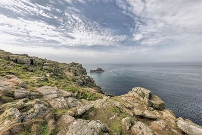 Scenic view of sea against cloudy sky