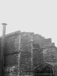 Low angle view of old building against clear sky