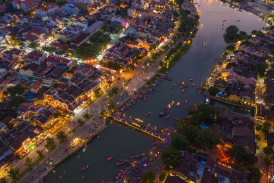 High angle view of illuminated buildings in city at night