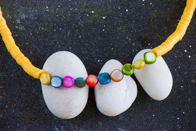 Colorful necklace and bracelet mix, beads and stone necklace, jewelry on the blue background