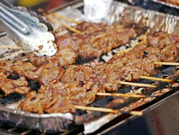 High angle view of meat on barbecue grill