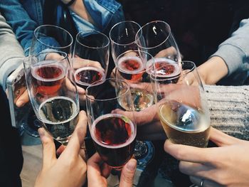 Cropped image of friends toasting wineglasses