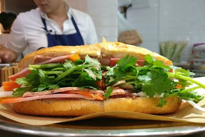 Close-up of man in plate on table